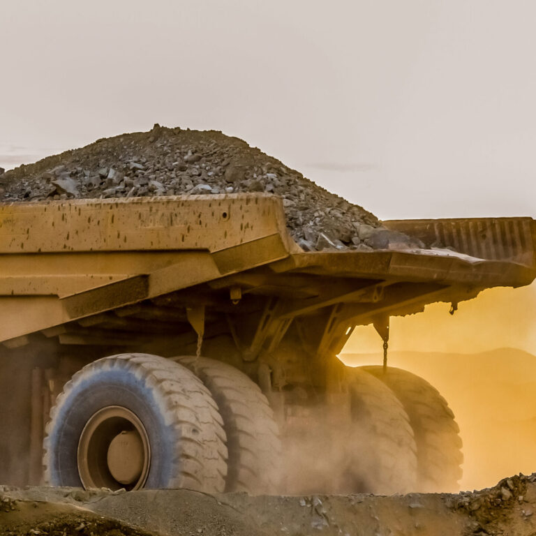 Large truck carrying sand on a platinum mining site in Africa